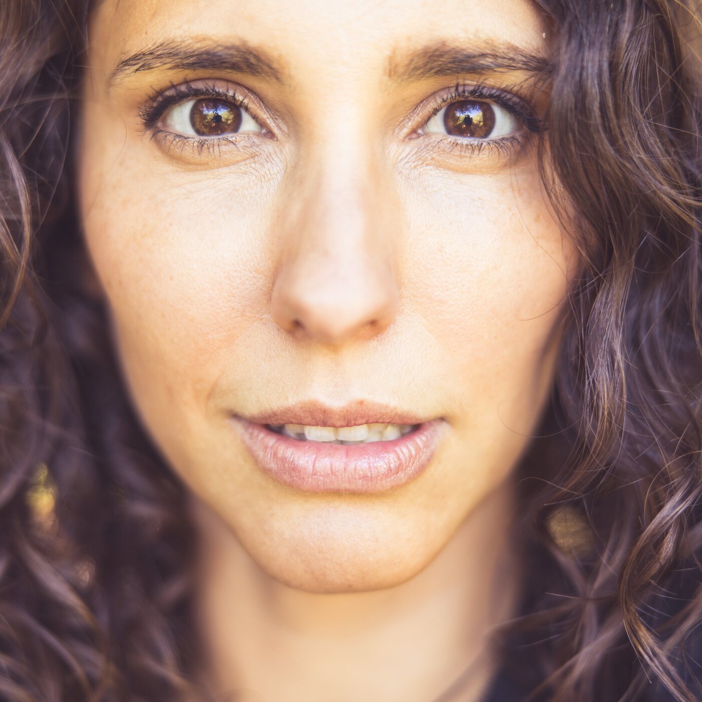 A warm, approachable close-up portrait of Bay Area dating coach Holly Brinkman